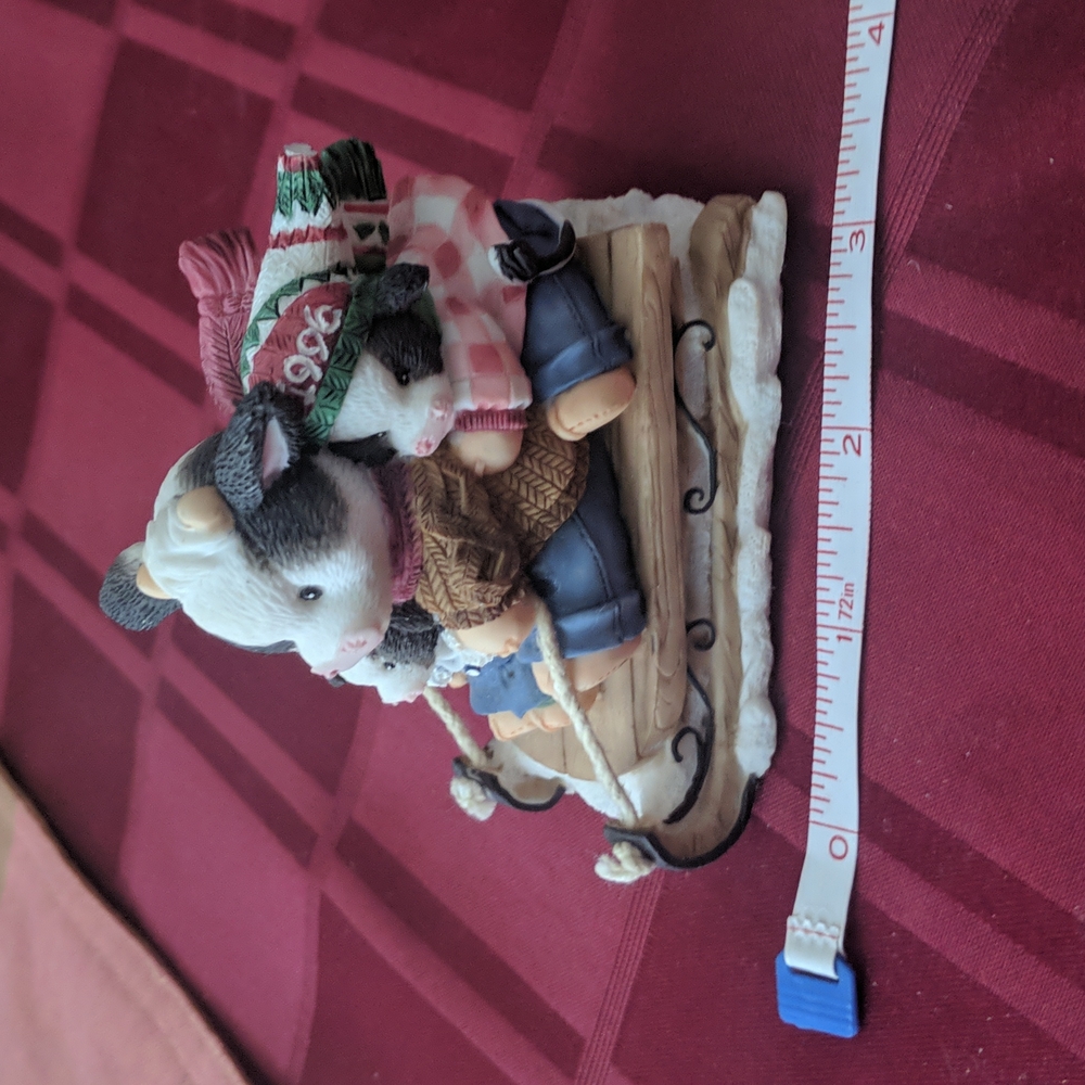 Mary's Moo Moos Collectibles, cow on winter sled.